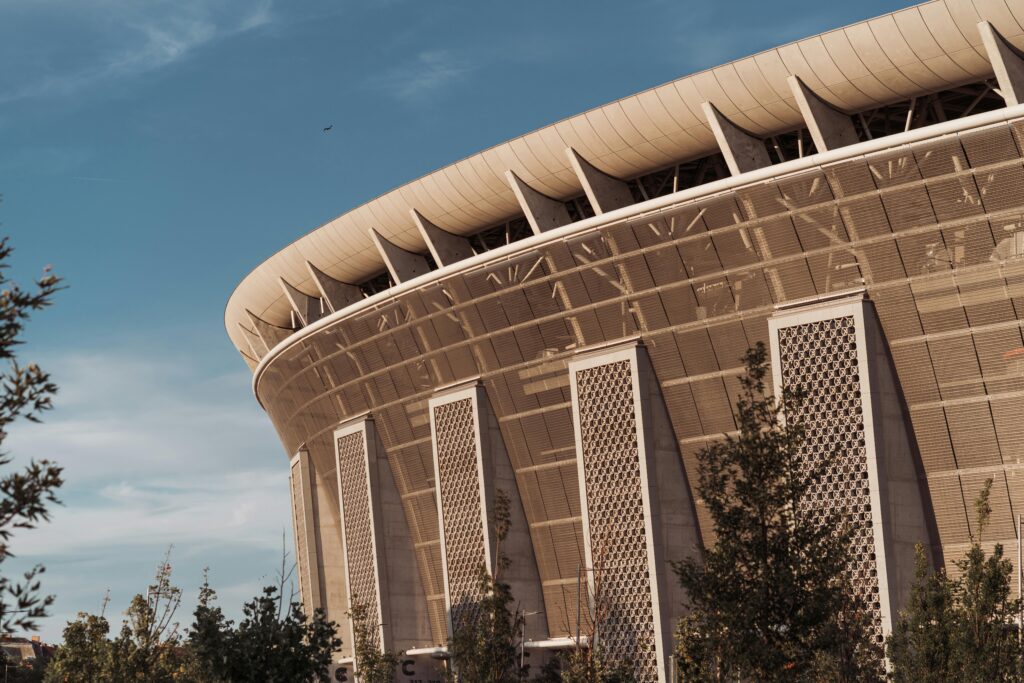 A close-up of Ferenc Puskás Stadium's architecture in Budapest, captured on a sunny day.